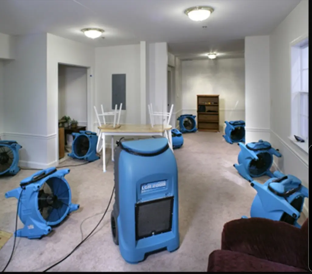 Air movers and dehumidifier setup for Water Damage Restoration in Gilford